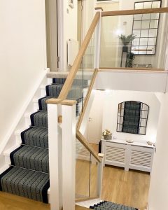 Herringbone Navy stairrunner leading to a kitchen