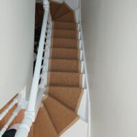 sisal-gold-beige-linen-border-stairrunner-on-winding-stairs