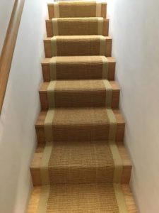 sisal-gold-beige-border-fitted-with-gripper-to-oak-staircase