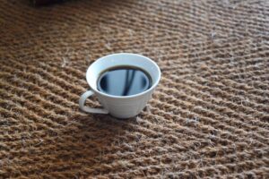 Coir Herringbone natural carpet & a cup of black coffee