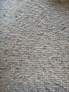 100% wool berber in a natural slightly flecky tone